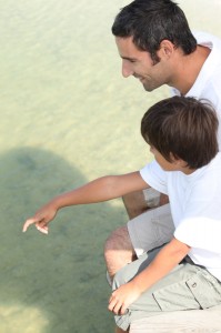 http://www.dreamstime.com/royalty-free-stock-photo-father-son-jetty-sat-image31379935