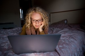 Millennial watching laptop